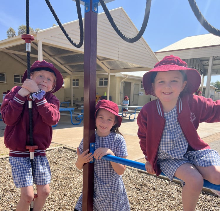 Three infants girls on equipment