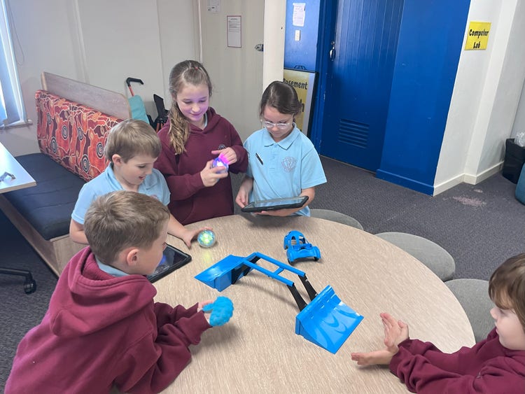 Students using Bee Bots in classroom.