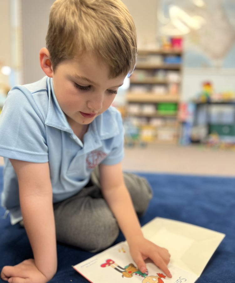Infants boy reading